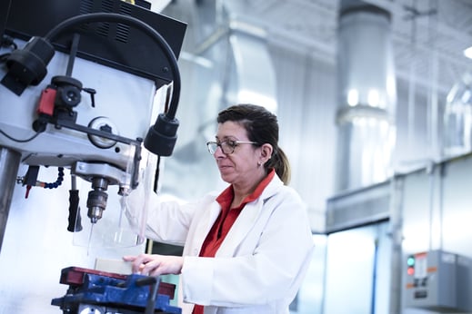 Woman printing a part made of ULTEM.